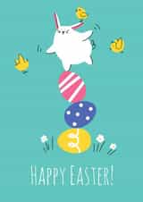 Cute easter greeting card with bunny balancing on painted eggs created by Nastea Fedorenko