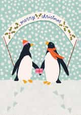 Cute Christmas card featuring penguins in a Winter snow scene created by Louisa Taylor