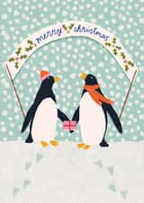 Cute Christmas card featuring penguins in a Winter snow scene created by Louisa Taylor