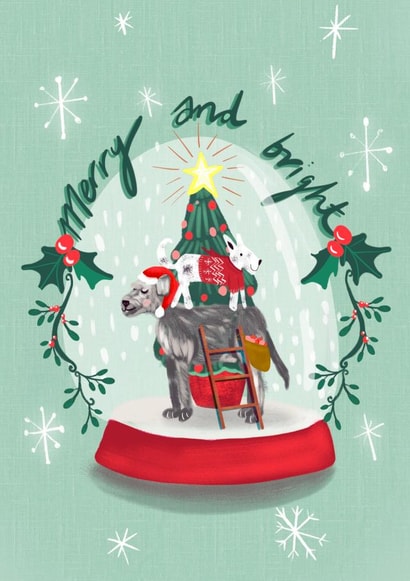 Festive decorating dogs inside snowglobe created by Sinead Peyton